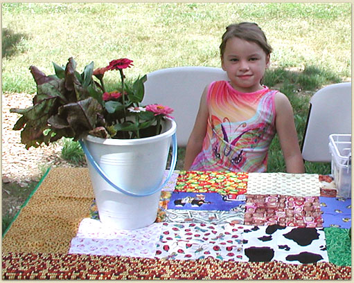 Anya is selling flowers at the Farmers Market to raise funds for the farm to buy a donkey.
